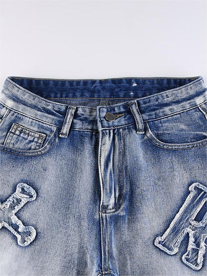 Boyfriend-jeans met vervaagd effect en letterpatch