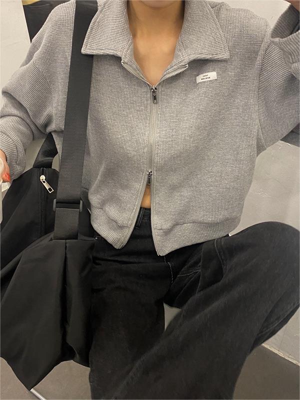 Veste courte zippée en blanc et gris